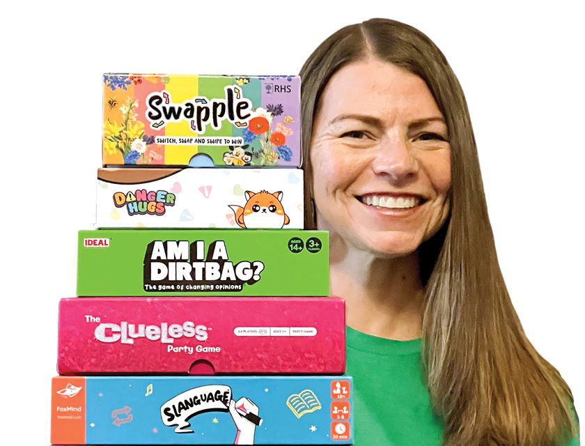 April Mitchel with some of her board games