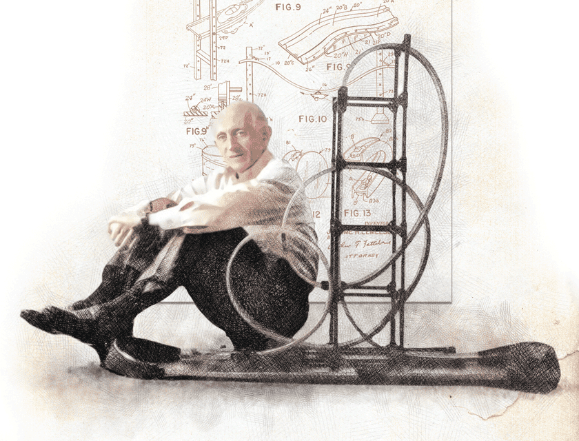 Jerry Lemelson sitting with the toy track he patented in 1969. The actual patent is shown in the background.