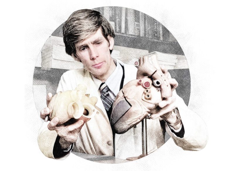 Dr. Robert Jarvik holding two artificial hearts